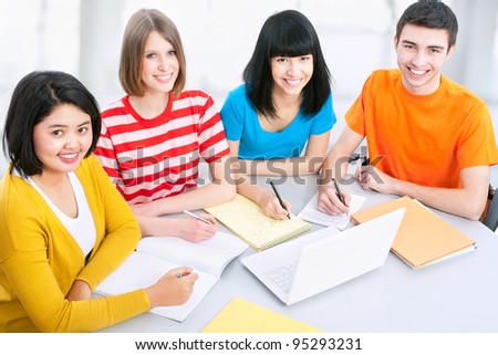 Young students studying together in a classroom