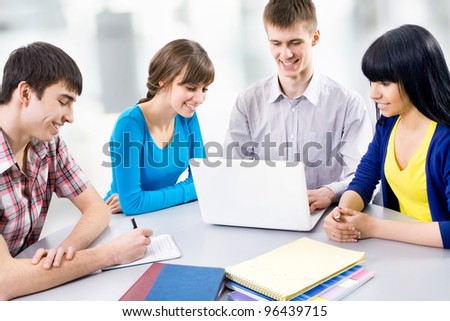 Young students studying together in a classroom