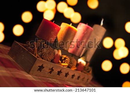 Christmas candles in a row with a nice background bokeh of lights