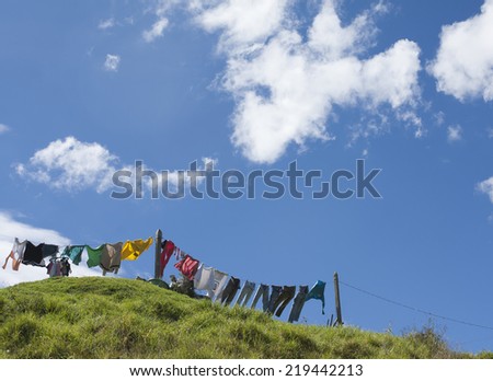 clothes drying rack blue background