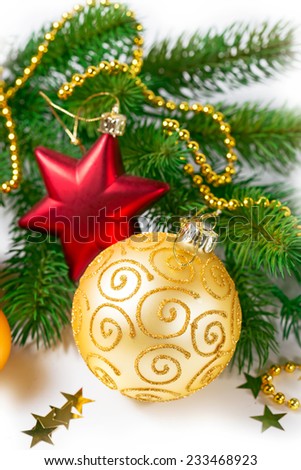 Red and Gold Christmas balls and green branch on white background