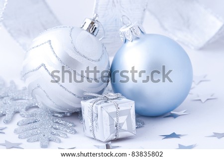 Silver christmas balls an gift on white background