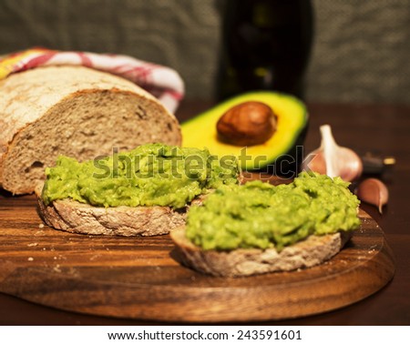 Homemade sandwich with avocado, garlic and olive oil