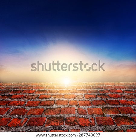 Fresh spring green grass with twilight sky sunlight and red brick floor. Beauty natural background