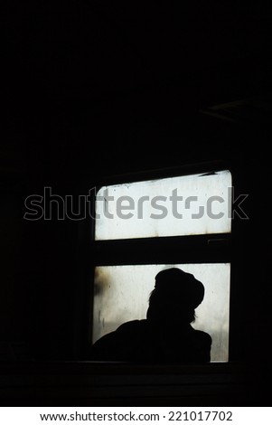 Passenger in train. Loneliness. Sad mood. Silhouette men