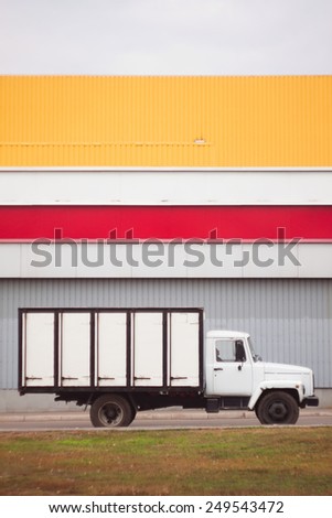 Striped truck. Parking near supermarket. Mobile trucker bread. Urban transport