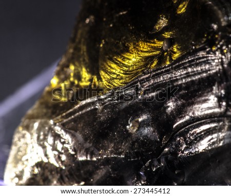 Glossy raw black obsidian (close-up)