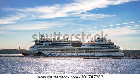 TALLINN, ESTONIA - JULY 3, 2015: Cruise liner AIDA Diva docked at the port of Tallinn, personnel prepares it for the next cruise.