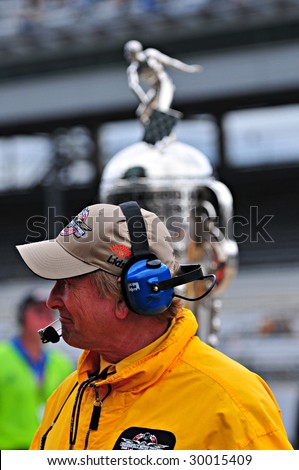 INDIANAPOLIS, IN - MAY 9: One of the crews of the Indy car racing team communicates in front of the Borg-warner trophy may 9, 2009 in Indianapolis, IN.