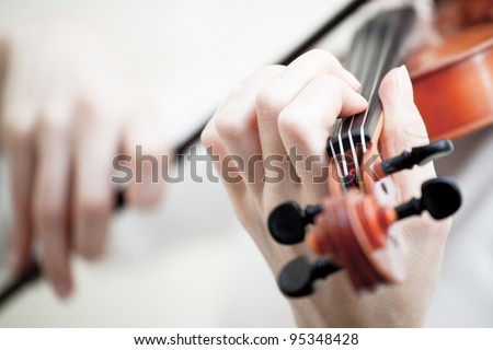 Musician playing violin isolated on white