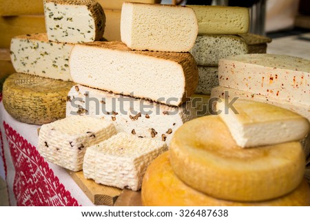 Handmade local cheese assortment, on a fair of traditional products, in Miercurea-Ciuc, Harghita, Romania. Shallow depth of field.