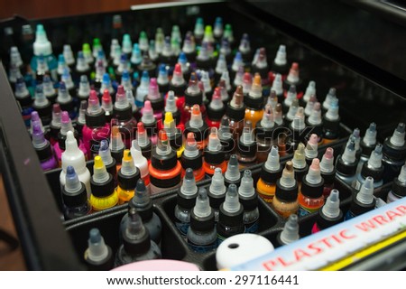 Many different bottles of ink colors for tattoo artist.
