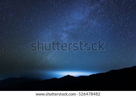 Beautiful star on night sky and Bright cloud over the mountain. Background