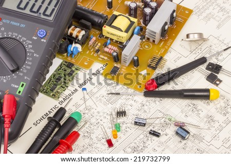 Workbench for electronics repair, multimeter, electronic components, electronic board, screwdrivers, transistors, integrated circuits, capacitors, all on electronic diagram background