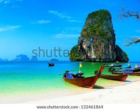 Thailand ocean beach Thai journey scenery landscape with wooden boats blue sky and clear sea water Thailand ocean beach Thai journey scenery landscape with wooden boats blue sky and clear sea water
