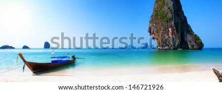 Travel boat on Thailand island beach. Tropical coast Asia landscape background