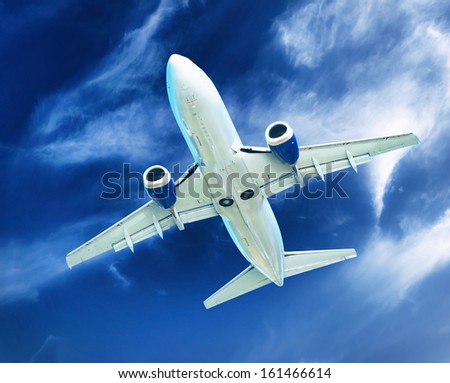 Airplane transportation. Jet air plane flies in blue sky