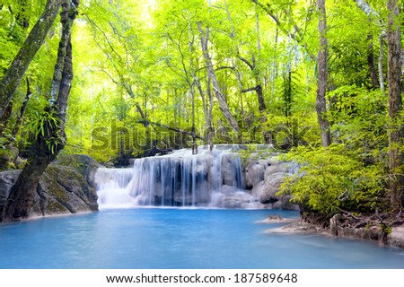 Waterfall in tropical forest nature landscape background