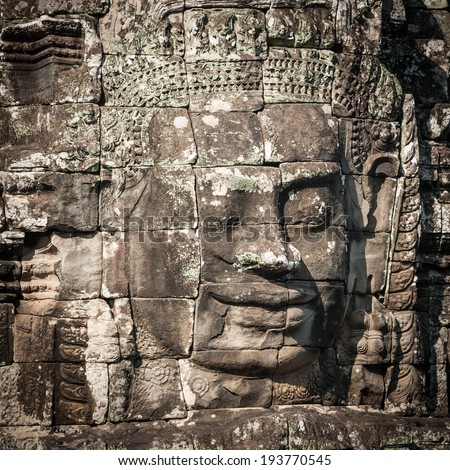 Angkor Wat Cambodia. Bayon temple in Angkor Thom historical place. Human face and figures murals and carvings