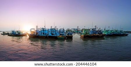 Vietnam, Phan Thiet, Mui Ne - fishing boats in harbor. Sunset photography
