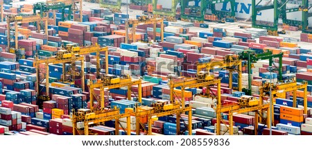 SINGAPORE - 2 JAN, 2014: Commercial port of Singapore. Thousands of steel containers waiting to be dispatch and shipped around the world from the biggest and busiest cargo port in Asia