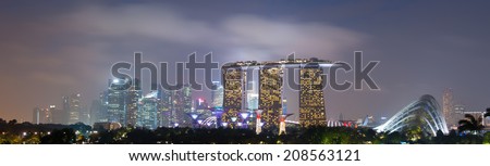 SINGAPORE - 31 DEC, 2013: Panoramic view of Singapore city skyline at late sunset. Marina Bay Sands downtown district is extremely popular travel destination in Asia