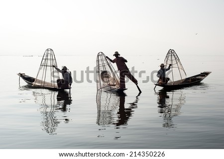 Traveling to Myanmar, outdoor photography of fisherman on traditional boat. Intha people from Shan state of Burma