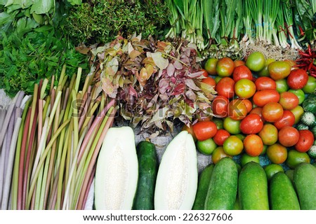 Various fresh vegetables in Asian traditional street market. Healthy food background