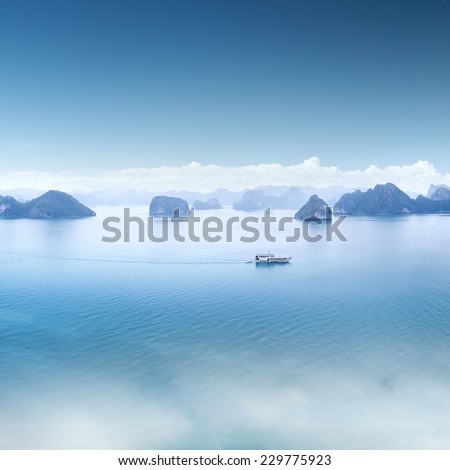 Blue water and sky aerial view panorama of Halong Bay in Vietnam. Scenic background landscape