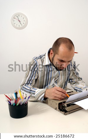 Man typing on old typewriter