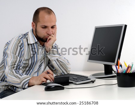Young business man working on computer