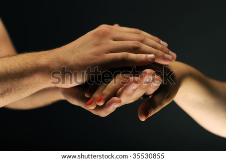 Hands caring and supporting each other