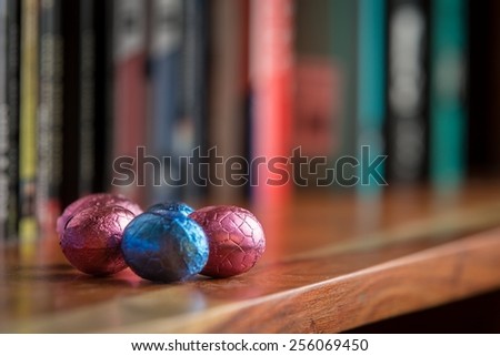 Chocolate Easter Eggs hidden on bookcase for early morning easter egg hunt