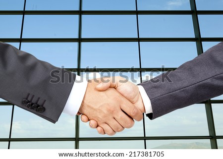 Business deal with business building backgraund