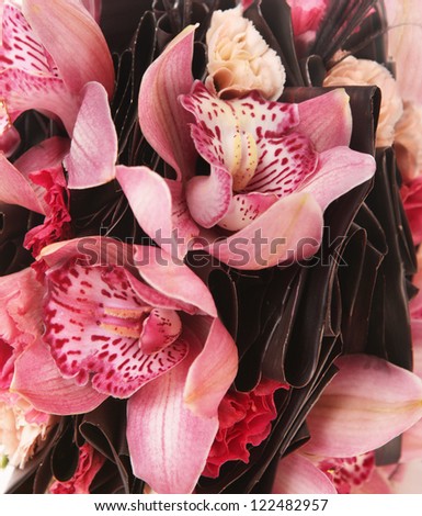 pink wedding bouquet of orchids as a background