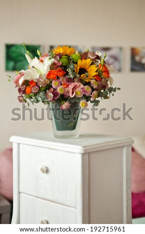 floral bouquet with lily, sunflower, chrysanthemum, eustoma (lisianthus) astrantsiya, eucalyptus, shrub rose