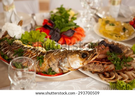 gefilte fish, vegetables and meats served on the festive table