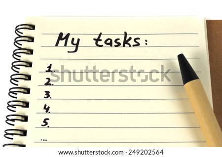 Hand drawing task list on notebook from recycling paper on white background