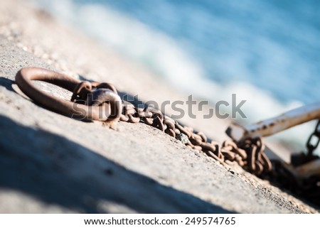 Rusty chains for small fishing boats in Riposto
