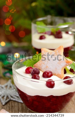 winter dessert with cranberries, cream and cookies