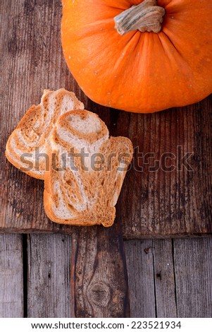 marble pumpkin bread with pumpkin on wooden background