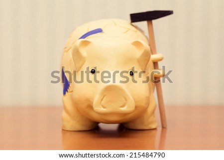 piggy bank with hammer, vintage look.