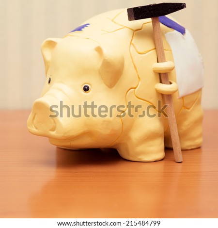 piggy bank with hammer, vintage look.