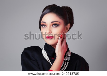 Beautiful woman portrait with vintage pearls necklace