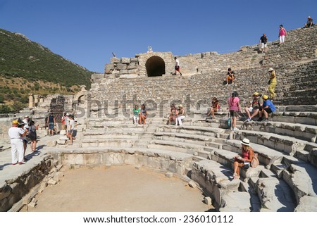 Ephesus, Turkey - August, 7 2013 :  Tourists admiring an ancient Greek and Roman Amphithetre. It is a popular tourist stop near the city of Izmir in Turkey.