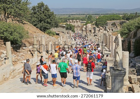 Ephesus, Turkey - August, 7 2013 : Lots of Tourists admiring an ancient Greek and Roman Library structure.It is a popular tourist stop near the city of Izmir in Turkey.