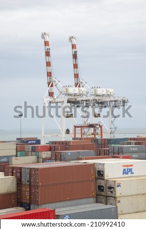 CHONBURI, THAILAND -JULY 22:  Working crane bridge with Container Cargo in Leamchabang industry marine port and cargo ship during transfer goods on July 22, 2014 in Chonburi, Thailand.
