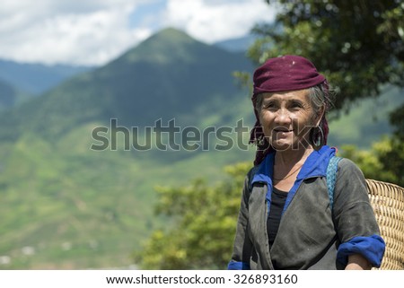 Thule village, Vietnam - 10 September 2014. Portrait of Black Hmong woman wearing traditional in Thule village, near Sapa, North Vietnam.