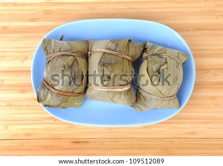Chinese rice dumplings (zongzi) wrapped in bamboo leaves,Chinese rice pudding