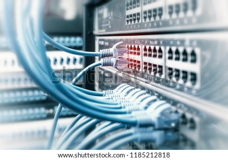 Network cables in switch and firewall in cloud computing data center server rack